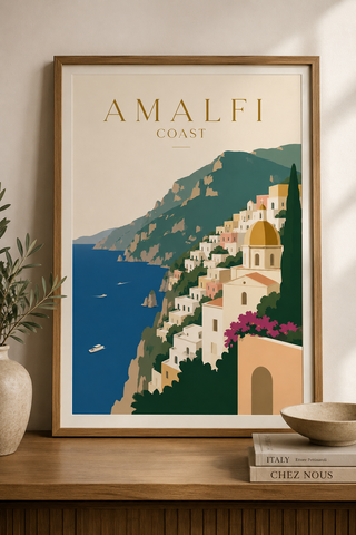 Framed artwork of the Amalfi Coast with a mountainous landscape and coastal village.