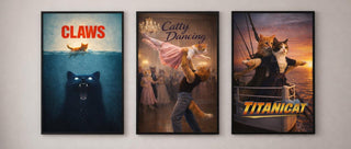 Three framed posters of cats inspired by famous movies on a wall above a sofa.