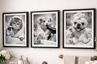 Bathroom with framed black and white photos of animals on the wall